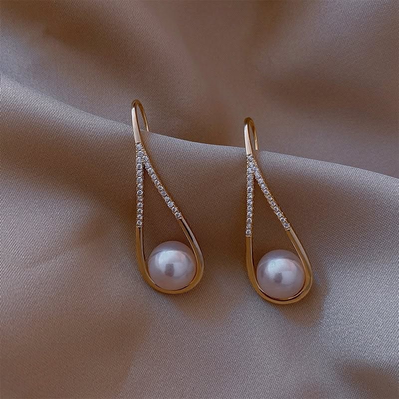 Gold teardrop earrings with pave detail and pearl drop