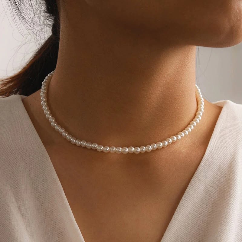 Pearl choker necklace worn on model