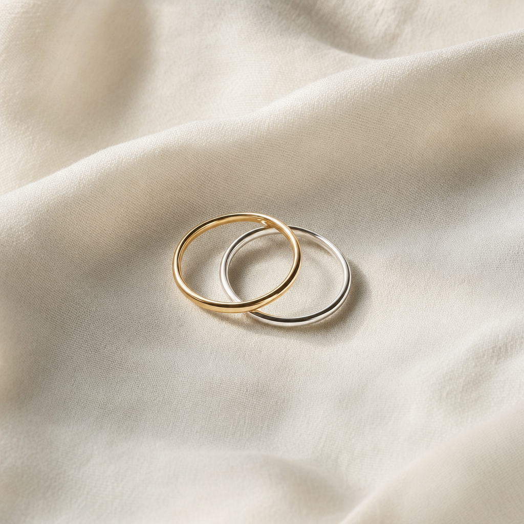 Sterling silver and gold vermeil stacking rings on linen