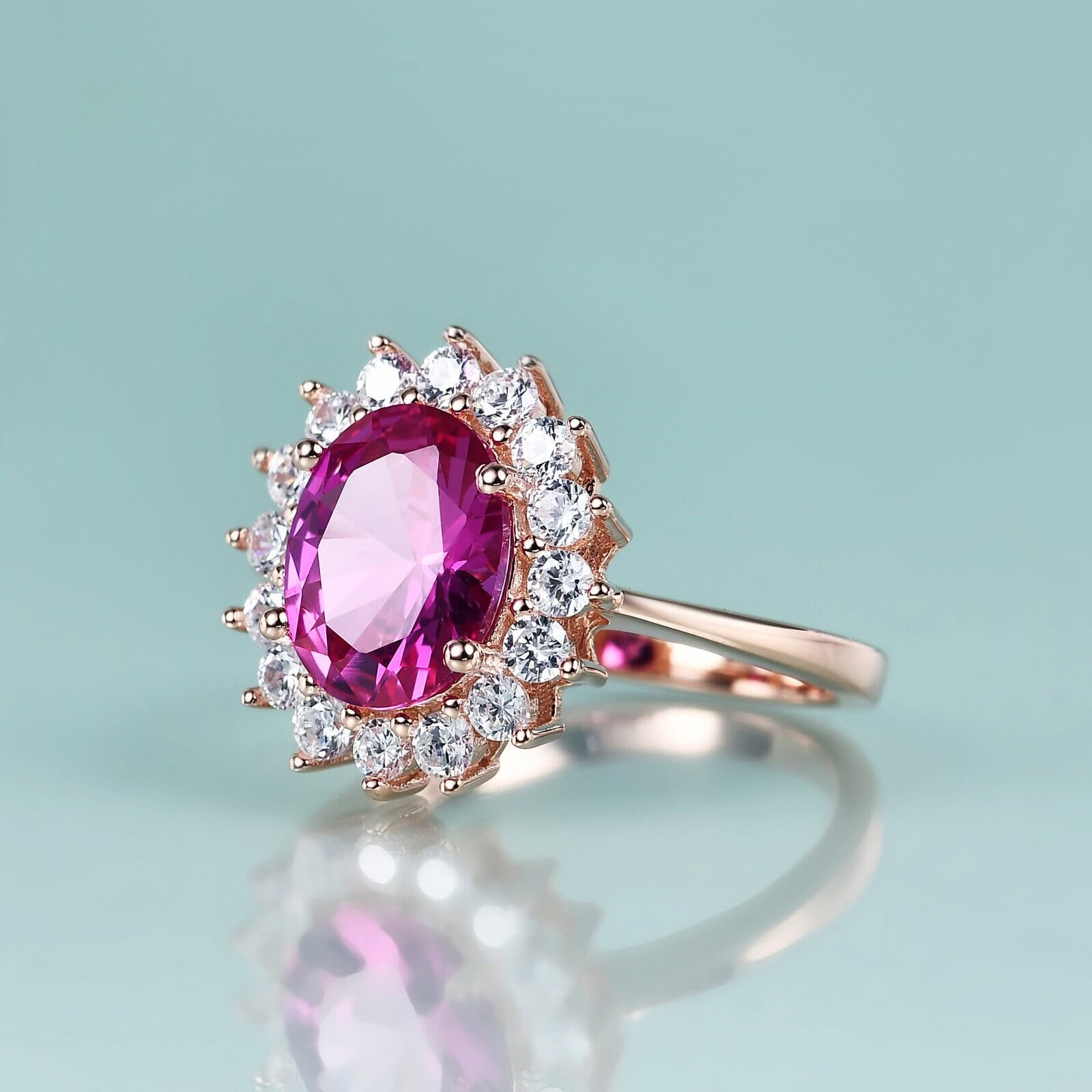 Rose gold ring with pink sapphire halo