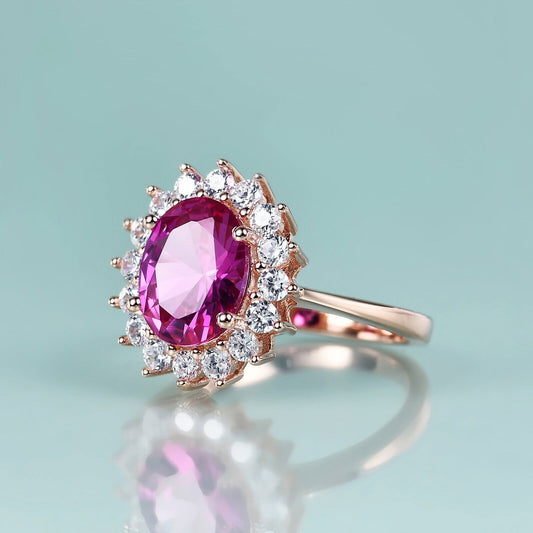 Rose gold ring with pink sapphire halo