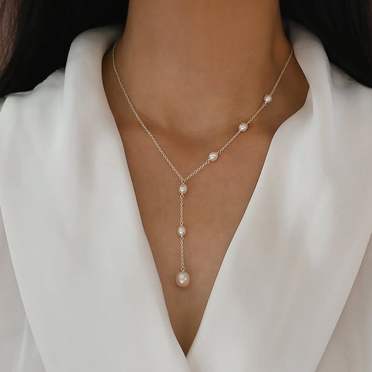 Silver pearl station lariat necklace worn on model